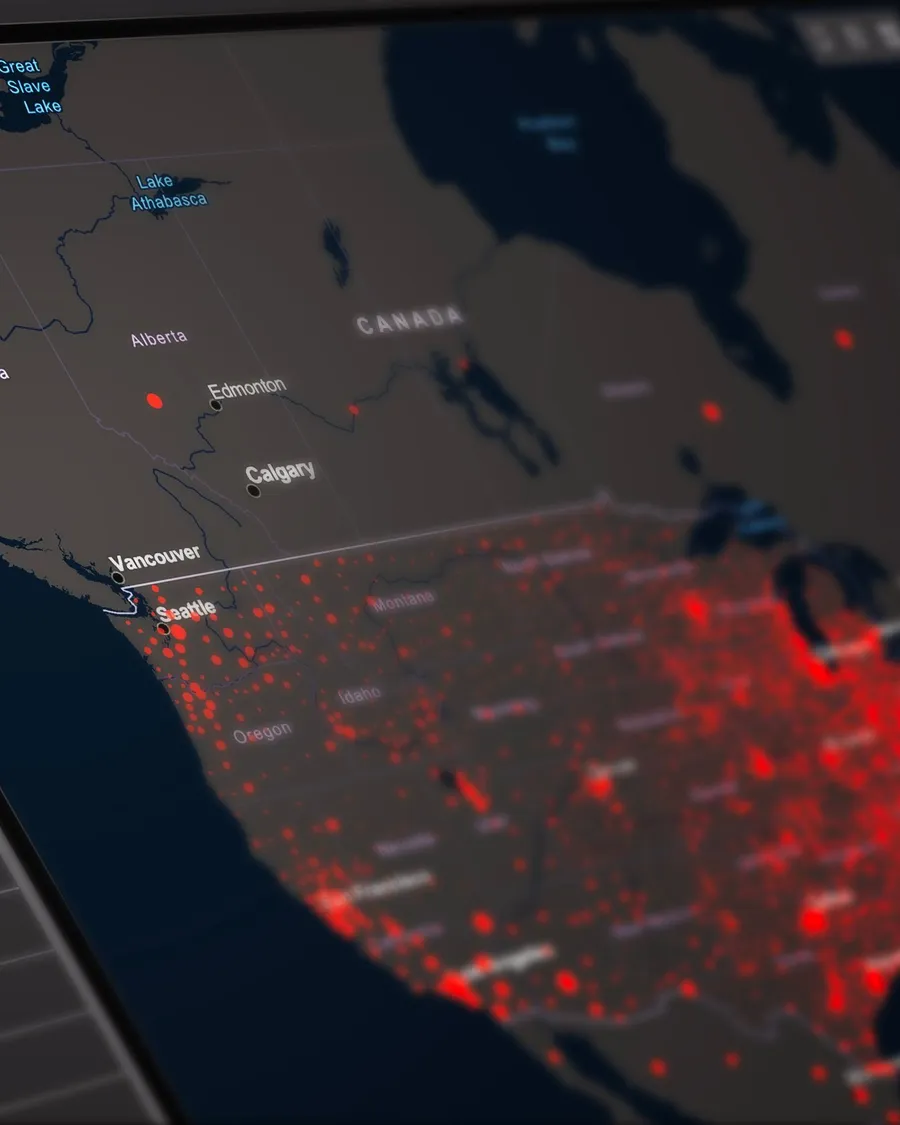 A dark-themed live map view with red markers clustered across a region, representing fleet and telemetry monitoring